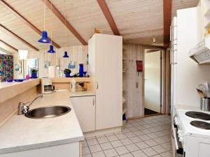a kitchen with a sink and a counter top at 10 person holiday home in Fan in Fanø