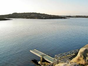 a dock in the middle of a large body of water at 2 person holiday home in TORSLANDA in Hällsvik