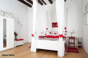 Postel nebo postele na pokoji v ubytování Aria e Luce Suites a Venezia