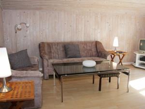 a living room with a couch and a coffee table at 6 person holiday home in Fjerritslev in Fjerritslev