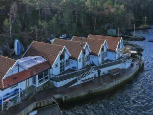 an aerial view of a row of houses on the water at Holiday home FOLDRØYHAMN in Foldrøyhamn