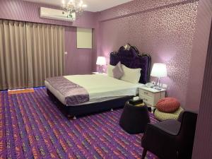 Postel nebo postele na pokoji v ubytování Chi Shing Hai Hotel