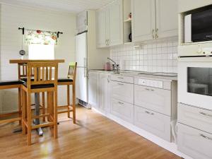 A kitchen or kitchenette at 4 person holiday home in Gr nna