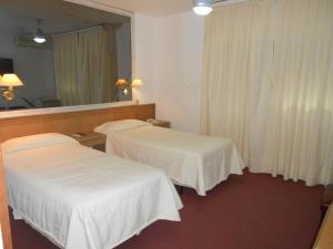 Voodi või voodid majutusasutuse Tanger Hotel toas