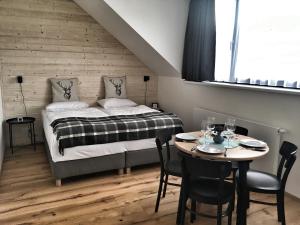 Postel nebo postele na pokoji v ubytování Apartmán Bambi Kvilda