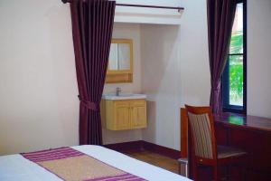 Postel nebo postele na pokoji v ubytování Punyin Hotel Inthanon -ปั้นหยิ่น โฮเทล