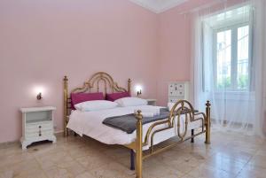 Postel nebo postele na pokoji v ubytování Le Stanze di Jole