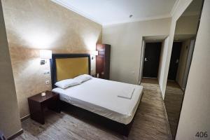 Postel nebo postele na pokoji v ubytování Atlantic Hotel