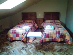 A bed or beds in a room at Casa Rural La Infanta
