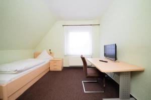 
Ein Bett oder Betten in einem Zimmer der Unterkunft Hotel Emshof
