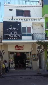 a building with a sign for a hotel tuna inn at HOTEL FINA INN in La Barca
