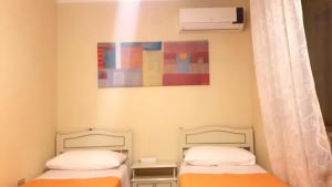 Postel nebo postele na pokoji v ubytování I 13 Cavalieri Guest House