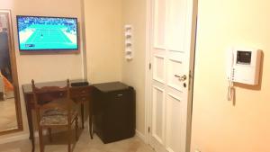 TV a/nebo společenská místnost v ubytování I 13 Cavalieri Guest House