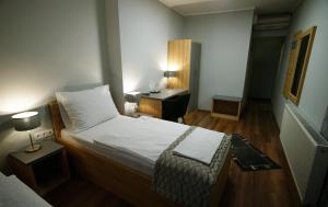 Postel nebo postele na pokoji v ubytování Dolce Vita Panzió