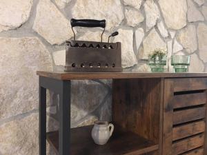 a wooden table with a stove on top of it at Casa Lisetta in Villa D'agri