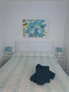 Postel nebo postele na pokoji v ubytování La casita de Evita