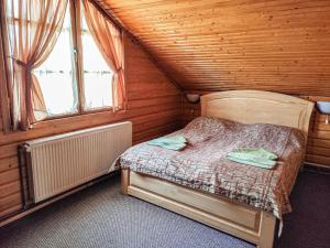 En eller flere senge i et værelse på Synya Gora