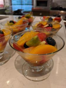 a group of bowls filled with fruit on a counter at Surf Song Bed & Breakfast in Tybee Island