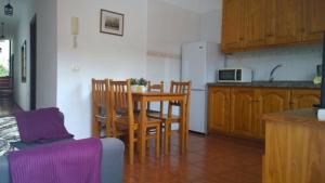 a kitchen with a table and chairs in a room at Casa del Cu bano B- Biosphere Reserve in Santa Cruz de Tenerife