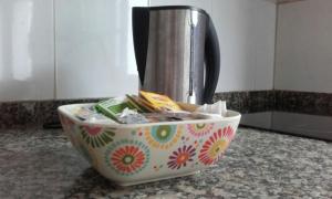 a coffee pot sitting in a bowl on a counter at Casa del Cu bano B- Biosphere Reserve in Santa Cruz de Tenerife