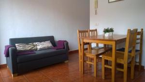a living room with a couch and a dining room table at Casa del Cu bano B- Biosphere Reserve in Santa Cruz de Tenerife