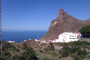 a view of a mountain with the ocean in the background at Casa del Cu bano B- Biosphere Reserve in Santa Cruz de Tenerife
