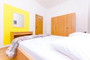Postel nebo postele na pokoji v ubytování Apartments Mate