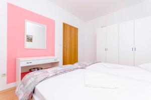 Postel nebo postele na pokoji v ubytování Apartments Mate