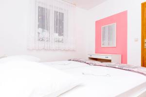 Postel nebo postele na pokoji v ubytování Apartments Mate