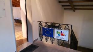 a stairway with a flag banner on a railing at La Mansardina in Matera +12 photos