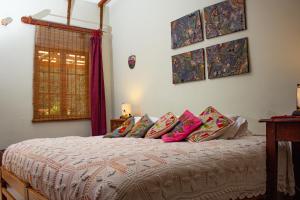 Postel nebo postele na pokoji v ubytování Casa Panqarani + 9 fotografií
