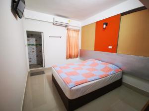 Postel nebo postele na pokoji v ubytování U Thong Hotel