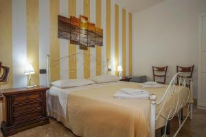 Posteľ alebo postele v izbe v ubytovaní B&B Le Terrazze