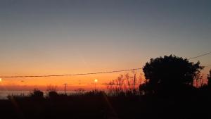 The sunrise or sunset as seen from a panziókat or nearby