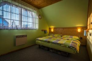 Posteľ alebo postele v izbe v ubytovaní Aquatherm Cottages Slovakia Liptov