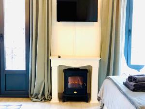 Μια τηλεόραση ή/και κέντρο ψυχαγωγίας στο Espectacular suite con vistas a la ría