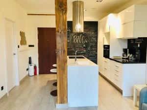 a kitchen with a counter with a sink in it at Espectacular suite con vistas a la ría in Bilbao