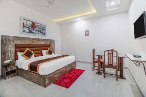 Ліжко або ліжка в номері Gracious by Vishesh Hotels & Home Stay