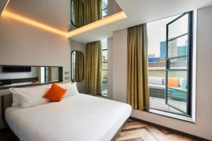 Postel nebo postele na pokoji v ubytování New Road Hotel