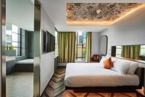 Postel nebo postele na pokoji v ubytování New Road Hotel + 37 fotografií