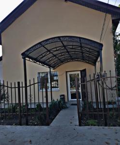 an entrance to a house with a metal gate at Hotel in Dnipro