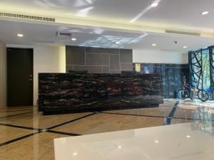 a lobby with a marble counter in a building at Chi Shing Hai Hotel in Dahan