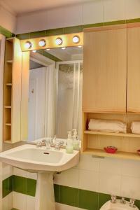 a bathroom with a sink and a mirror at Marcolski Home 2 in Breuil-Cervinia