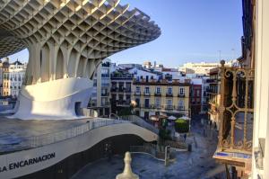 a view of a building in a city at Apartamentos Setas Center in Seville