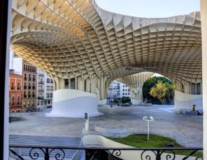 a view of a building with a large wooden ceiling at Apartamentos Setas Center in Seville