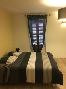Postel nebo postele na pokoji v ubytování Chambres d'Hôte Les Bredins