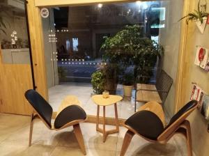 A seating area at Shan Shan Come Later