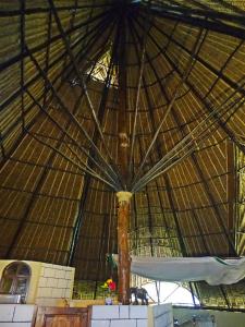 a large umbrella in the middle of a building at Diani-Paradise-Villas in Diani Beach