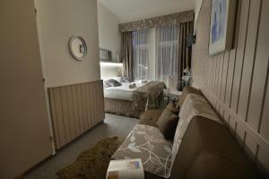 Postel nebo postele na pokoji v ubytování Anette Hotel