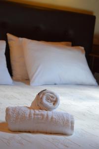 Posteľ alebo postele v izbe v ubytovaní Hagiati Anastasiou Hotel & Spa